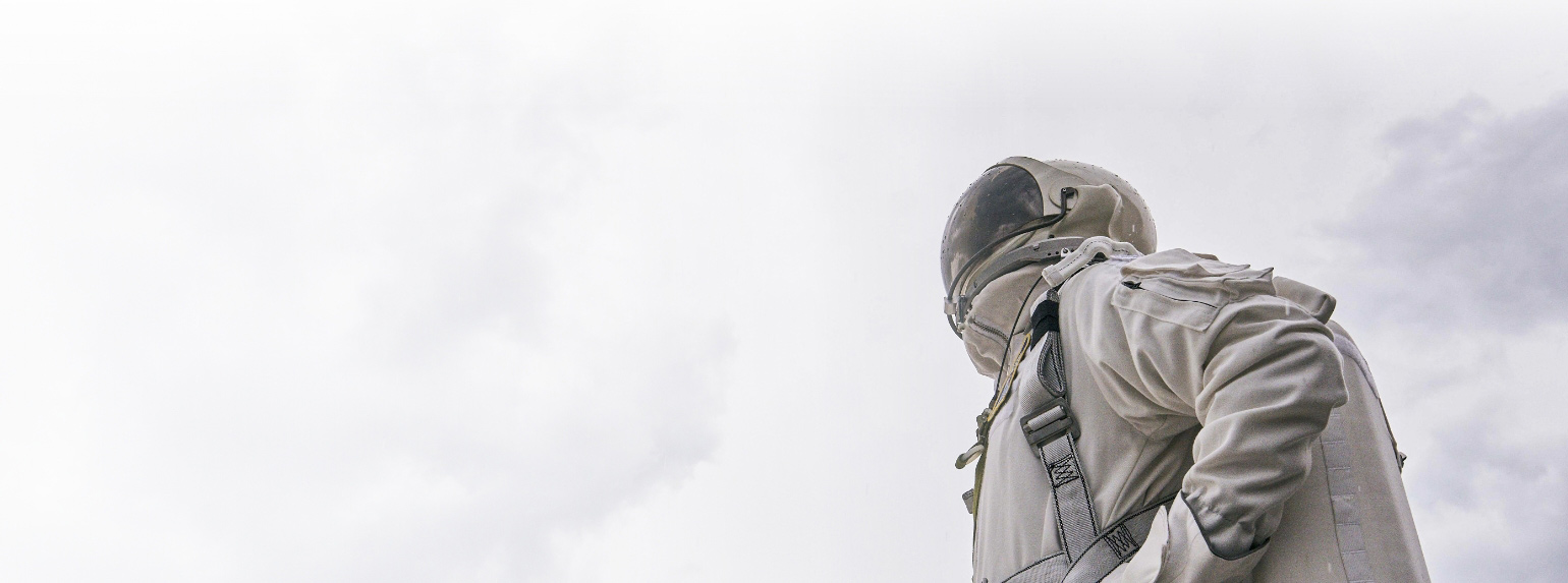 Astronaut looking up to the sky